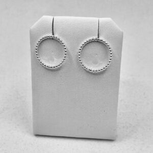 Earrings shaped as circles of thin, dotted silver wire.